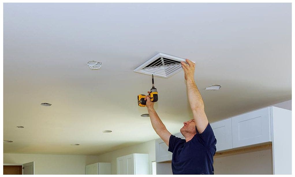 Man installing HVAC Register Grille